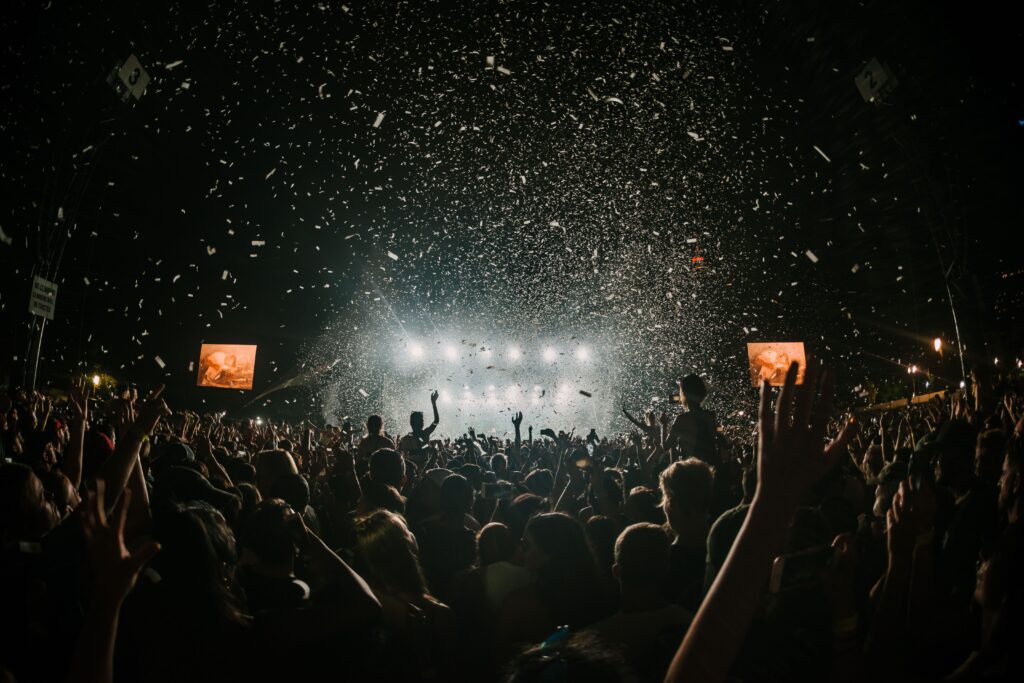 people gathering on concert field